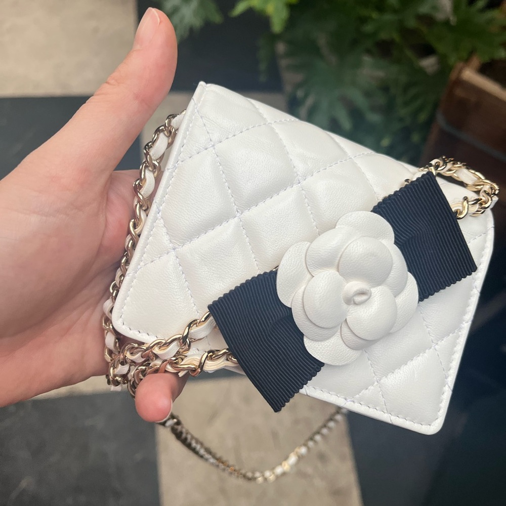 BRAND NEW AUTHENTIC CHANEL white wallet with chain and bow